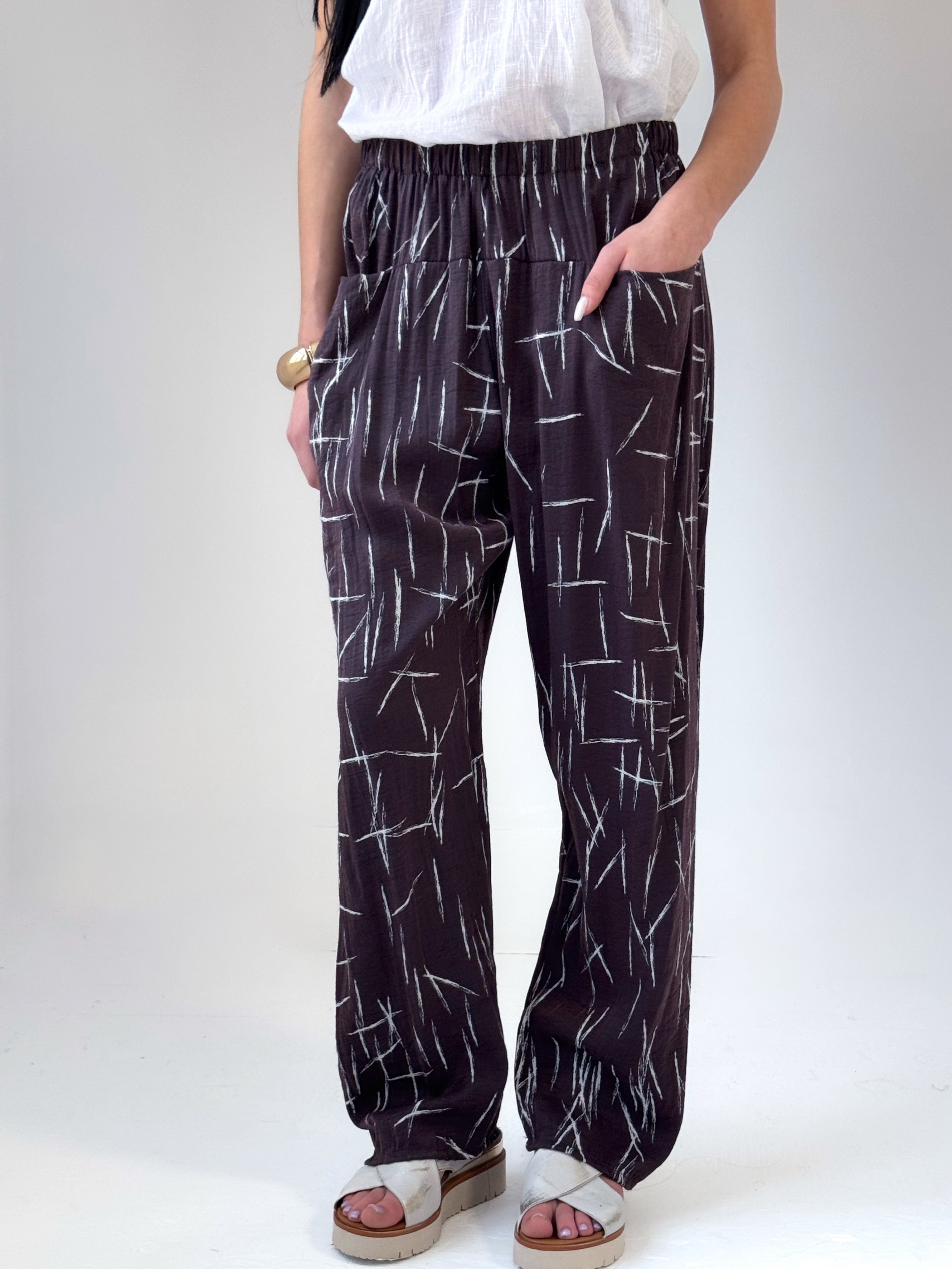 Remy loose fit pants in espresso viscose satin with abstract quill print and elastic waistband