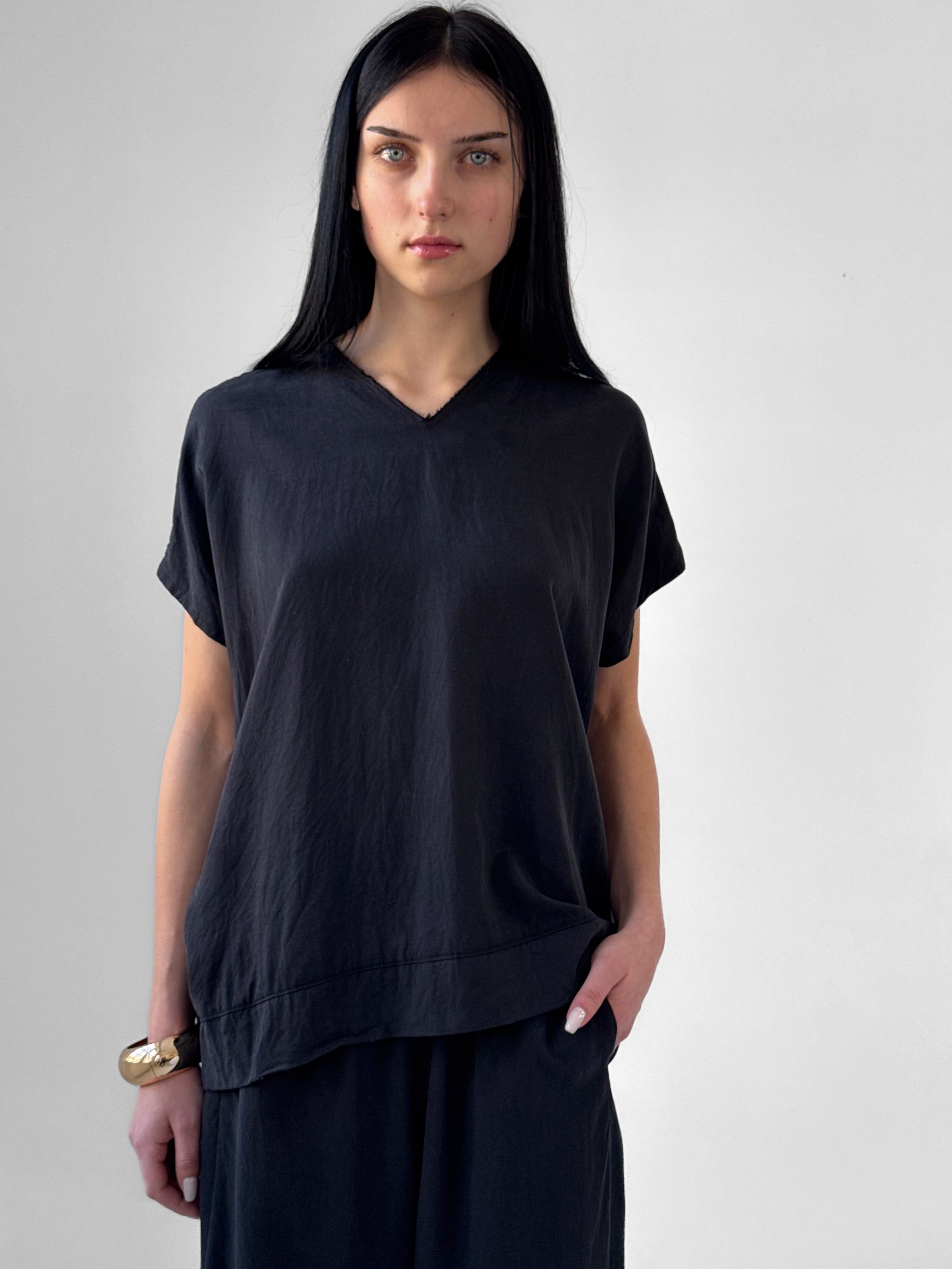 Lark washed tencel top with raw edge high V neckline and relaxed fluid silhouette, black minimalist blouse in modern understated style