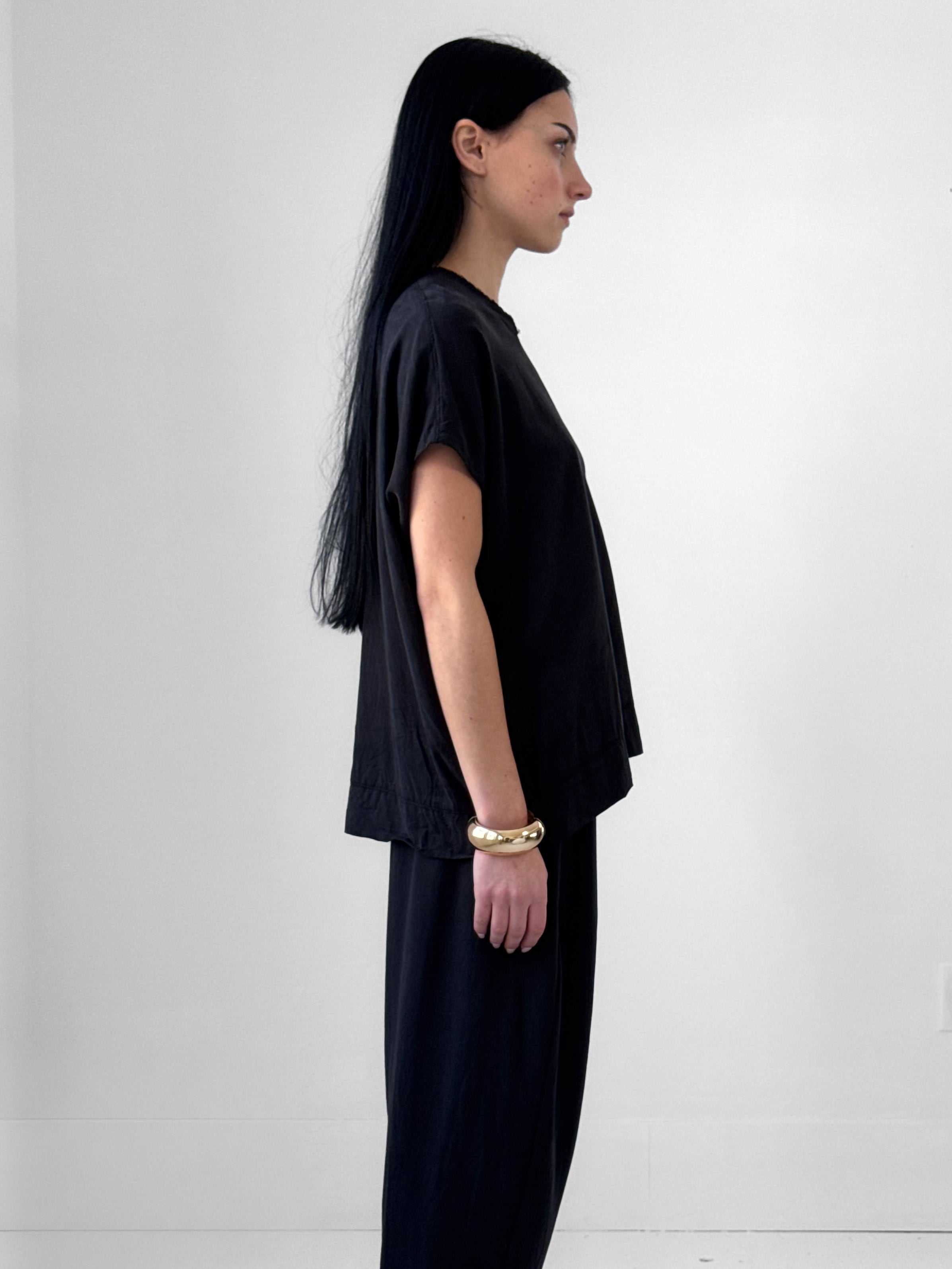 Lark washed tencel top with raw edge high V neckline and relaxed fluid silhouette, black minimalist blouse in modern understated style