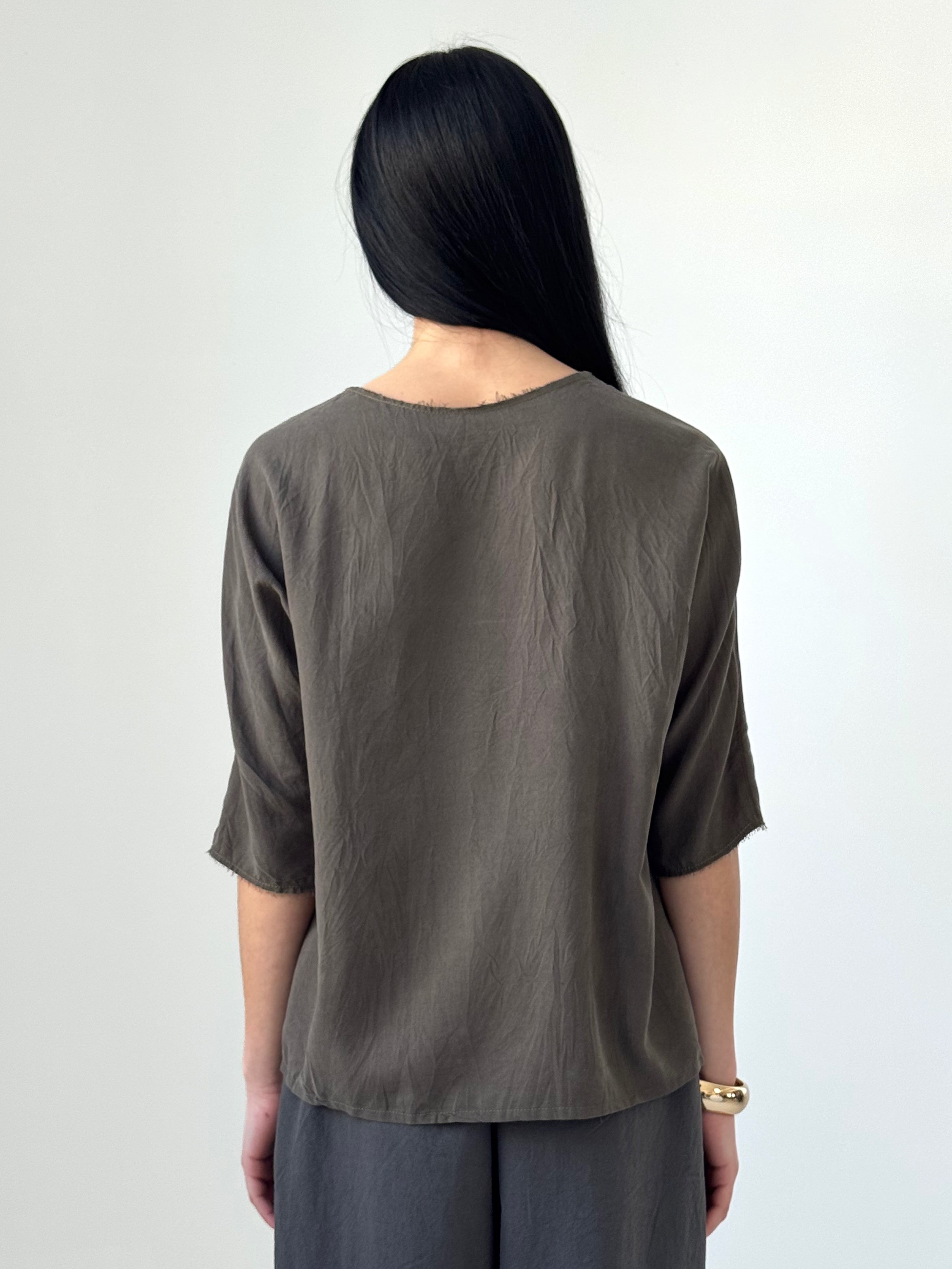 Orin washed tencel twill top with elastic ruching and raw edge neckline, fluid minimalist blouse in soft charcoal tone, modern understated style