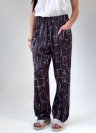 Remy loose fit pants in espresso viscose satin with abstract quill print and elastic waistband