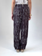 Remy loose fit pants in espresso viscose satin with abstract quill print and elastic waistband